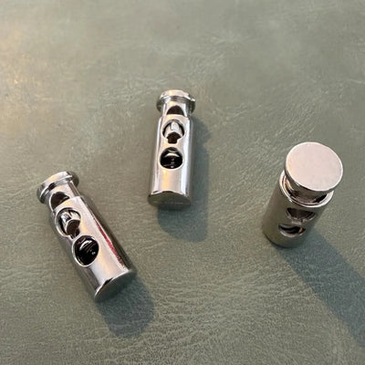 Metal cord lock E-1915 Nickel 2.5 cm – Double hole, Classic model