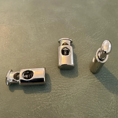 Metal cord lock E-299 Nickel 2 cm – Single hole, Ellipse model