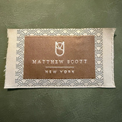 Jacquard woven label LBL 0024 8 x 4.5 cm – gold effect, premium wavy design, with logo