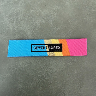 Jacquard woven label LBL 0031 8.5 x 1.7 cm – multicolor style, soft premium design, with logo
