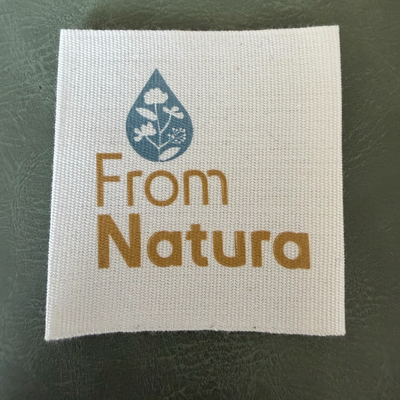 Printed canvas label LBL 0075 5.5 x 5.5 cm – white base with color print, soft premium design, with logo, MOQ 1000 pcs