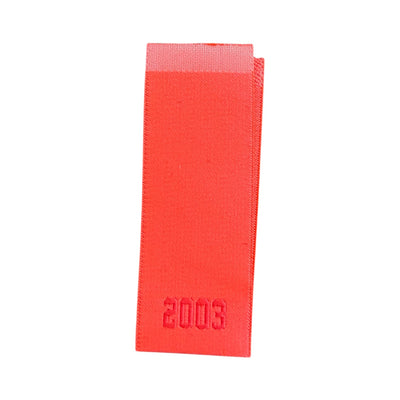 Woven label 12 cm x 2.5 cm – center-folded for branding