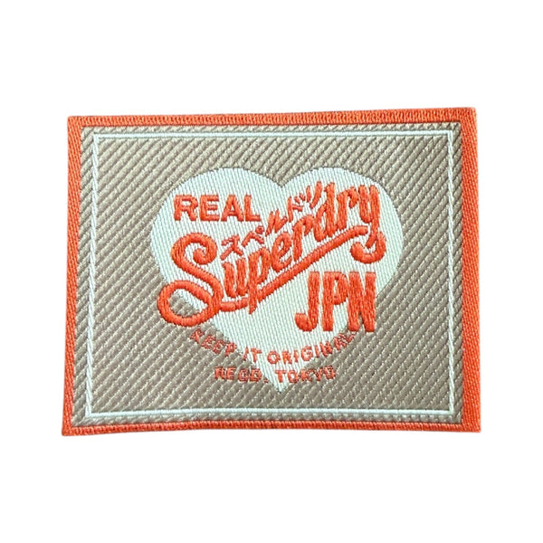 How to Sew a Label onto Clothing – By Hand and by Machine