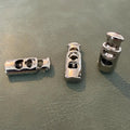 Metal cord stopper E-686 Nickel 2.5 cm – Double hole, Ellipse model