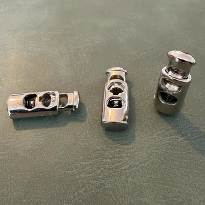 Metal cord stopper E-686 Nickel 2.5 cm – Double hole, Ellipse model