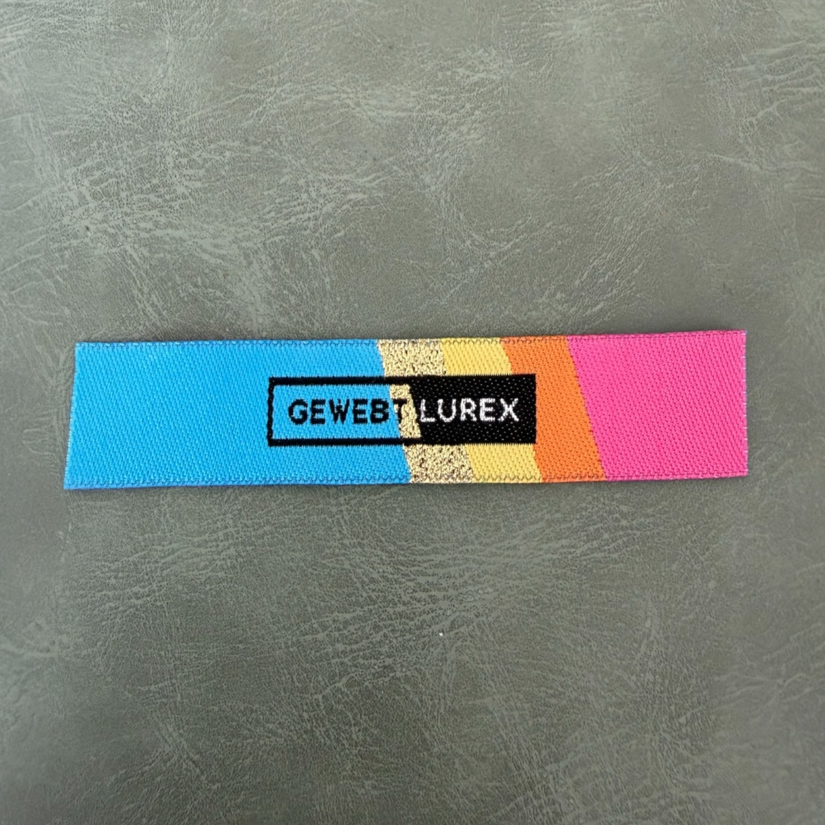 Jacquard woven label LBL 0031 8.5 x 1.7 cm – multicolor style, soft premium design, with logo
