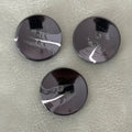PB-291 COL 1 Glossy black polyester button with 2 holes (15–28 mm)