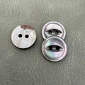 SHELL 10 SMOKE / GREY – Grey mother-of-pearl 2-hole button with a stripe, luxury jewelry-style