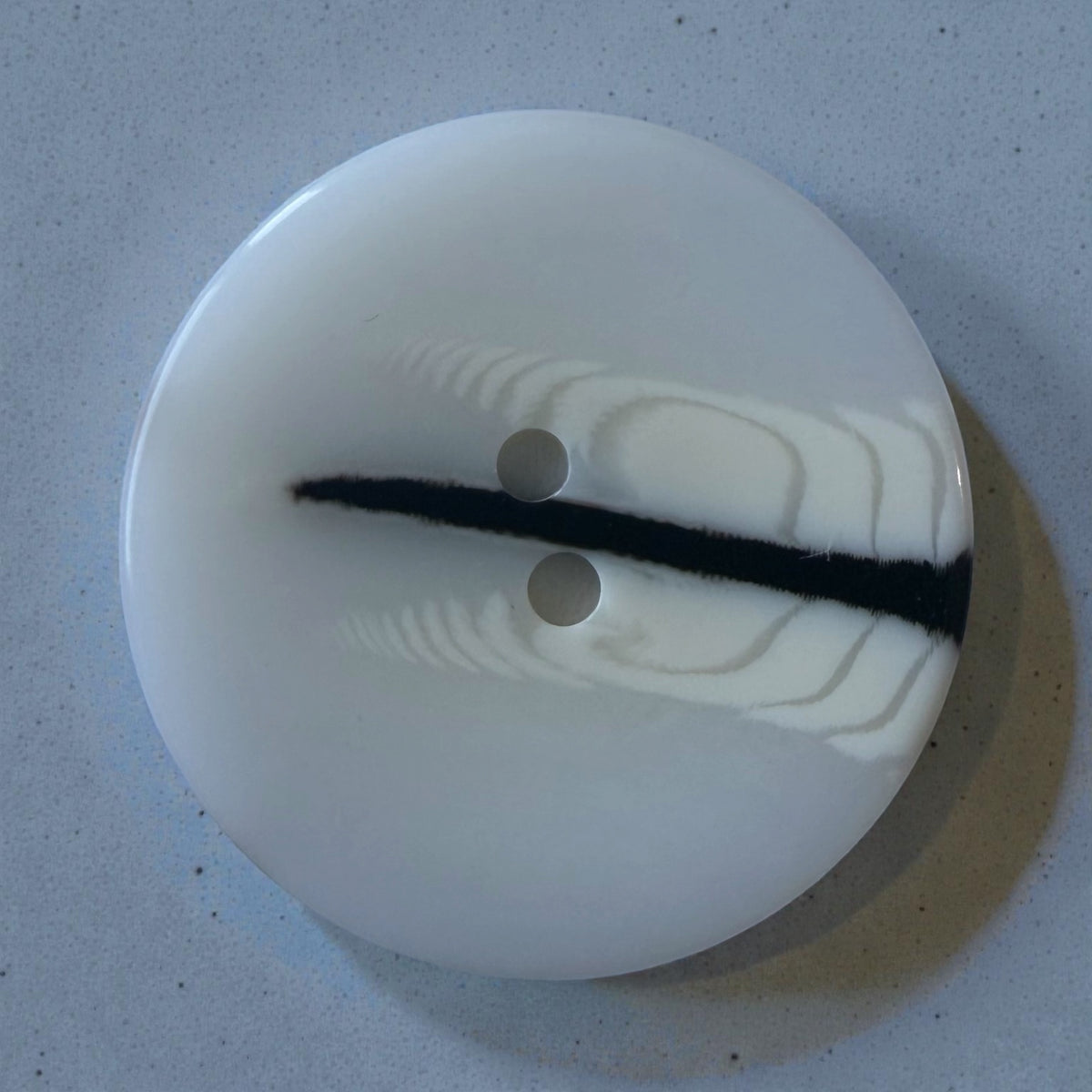 Melange polyester buttons PG 291 Col 4 – glossy white with a black stripe