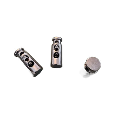 Metallinen nyöristoppari E-1915 Gun Metal 2.5 cm – kaksi reikää, klassinen malli
